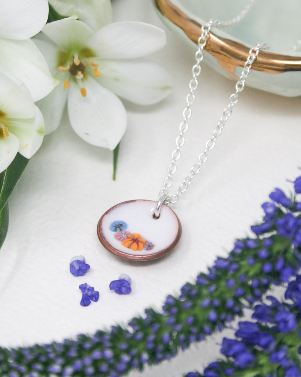 a necklace with a picture of a butterfly on it