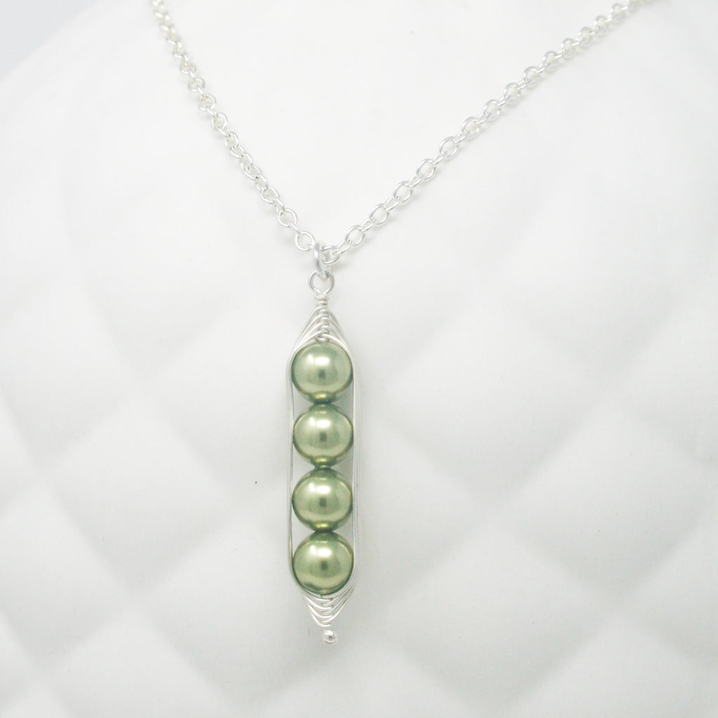 three peas in a pod on a chain