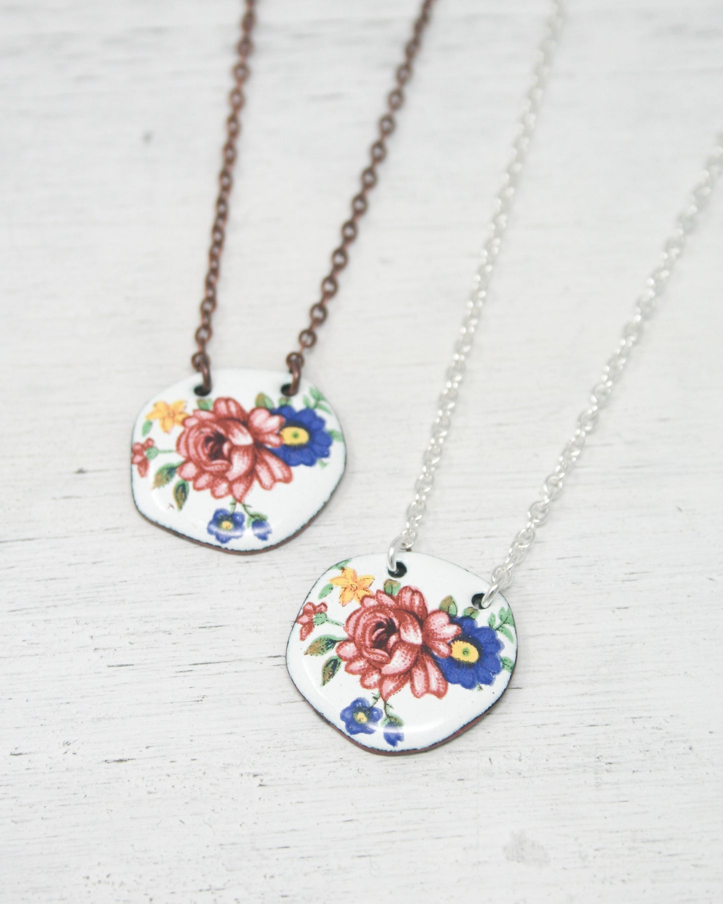 a couple of necklaces that are sitting on a table
