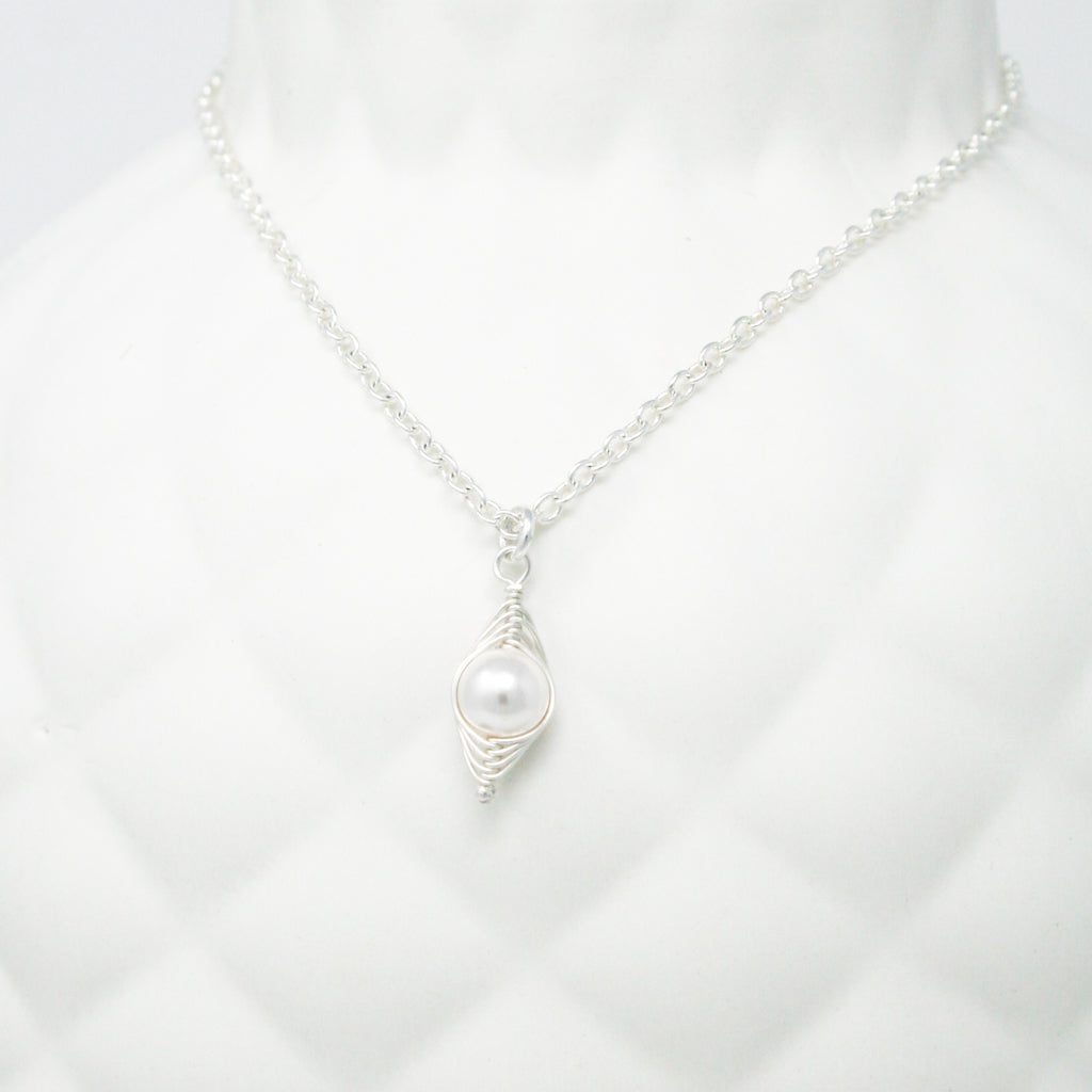 a white necklace with a pearl on it