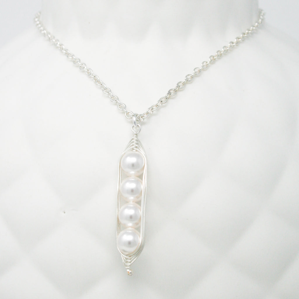 a close up of a necklace on a mannequin