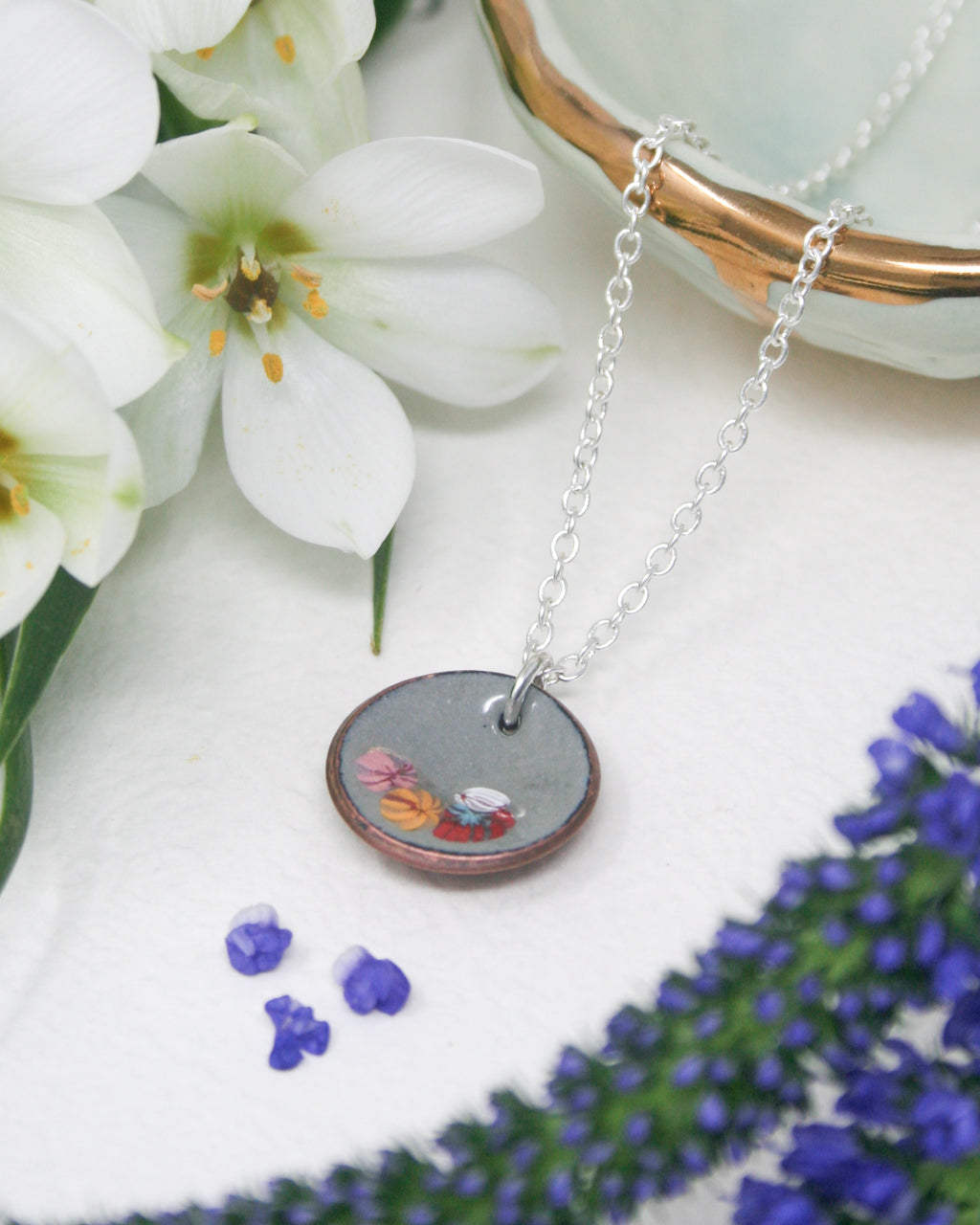 a necklace with a picture of a woman on it