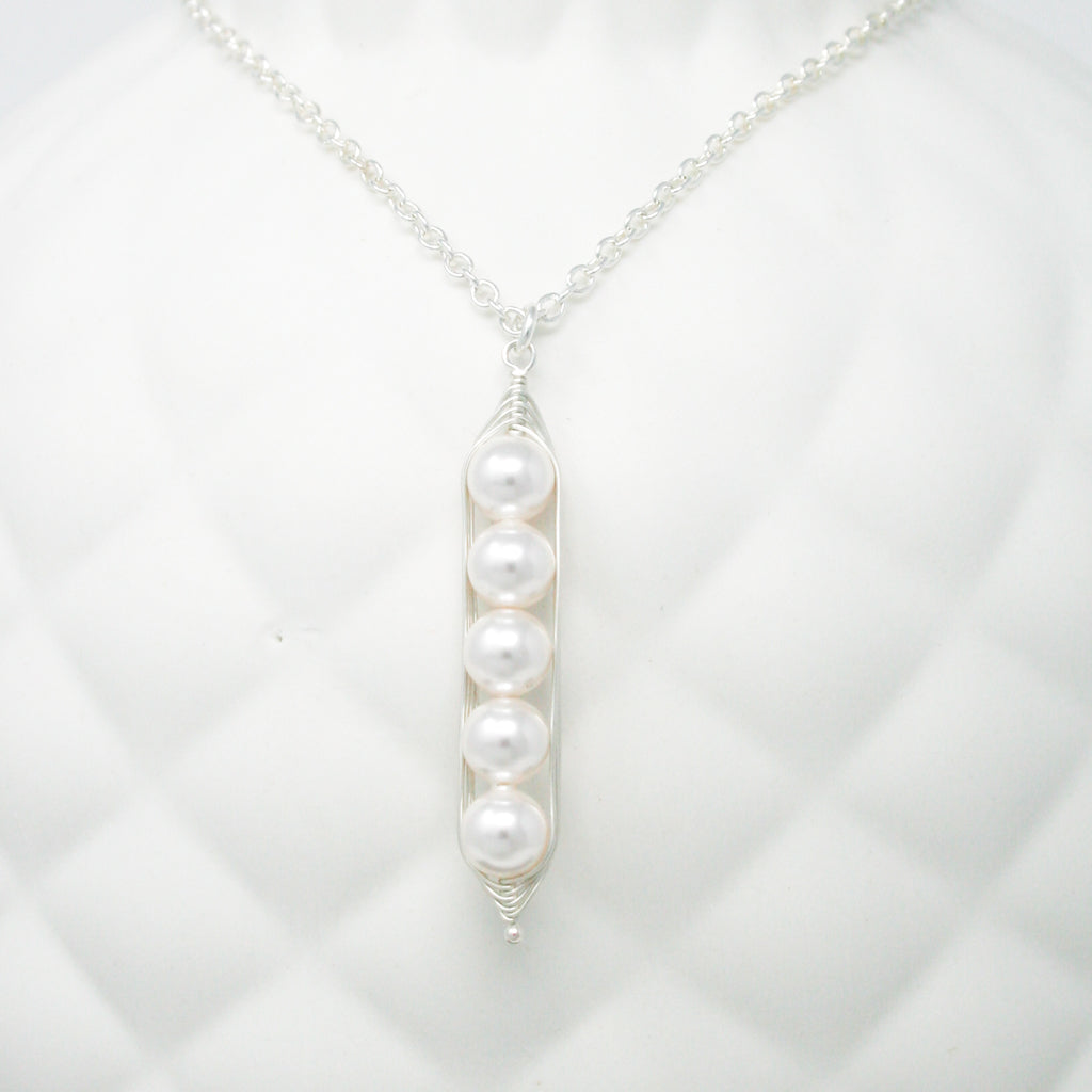 a close up of a necklace on a mannequin