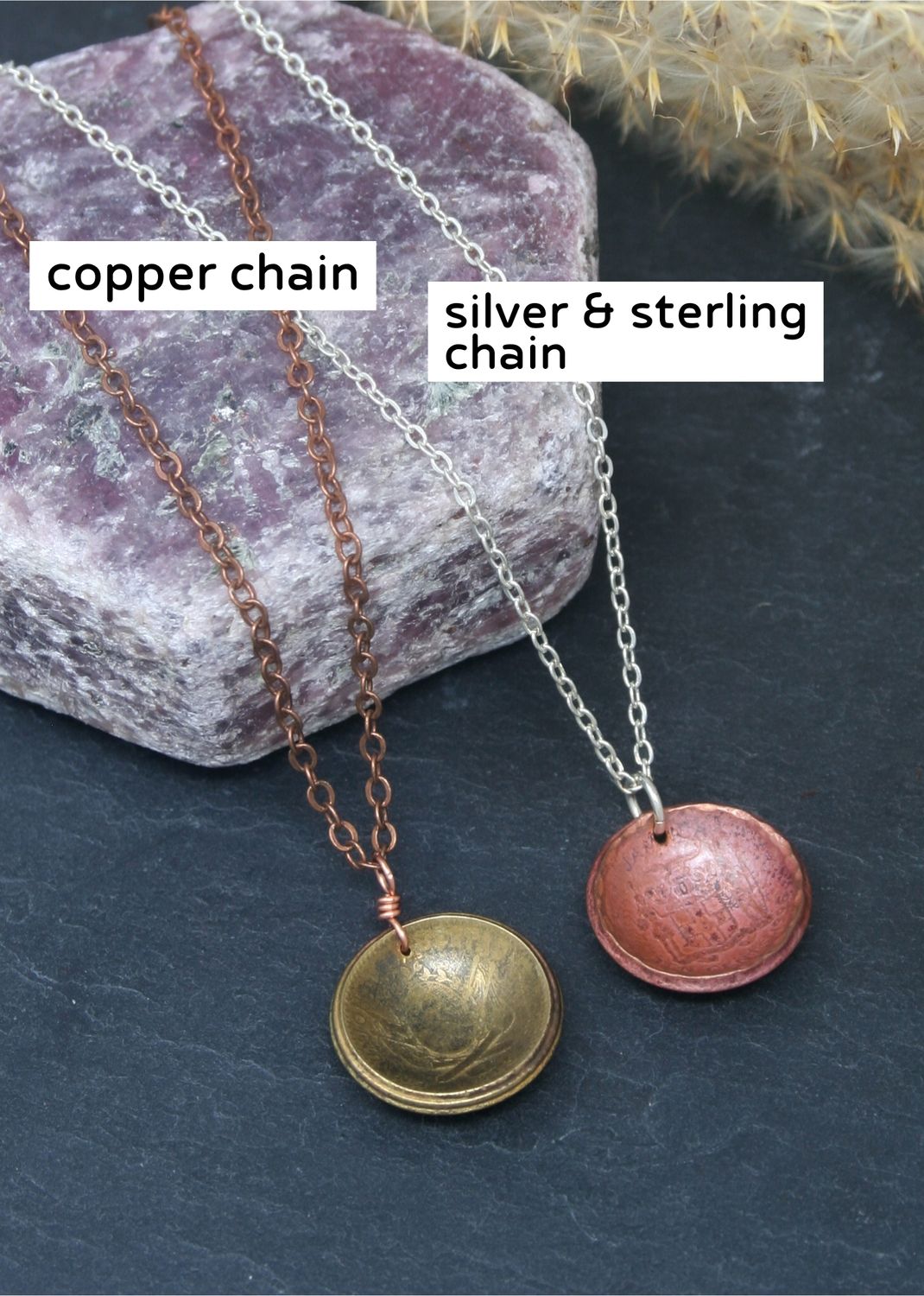 two necklaces, one made of copper chain and the other made of silver and sterling chain, resting on a purple rock.