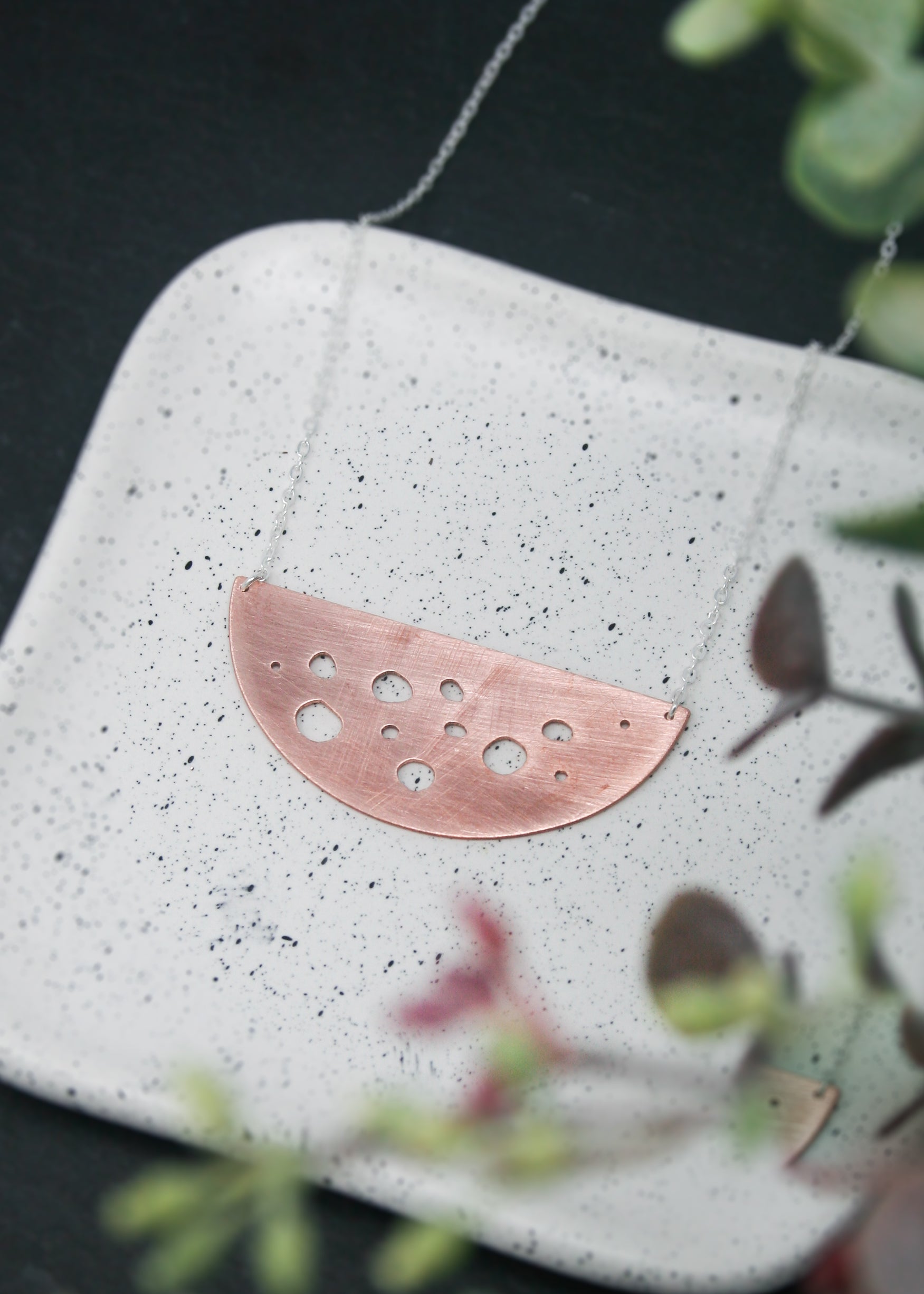 a piece of metal sitting on top of a white plate