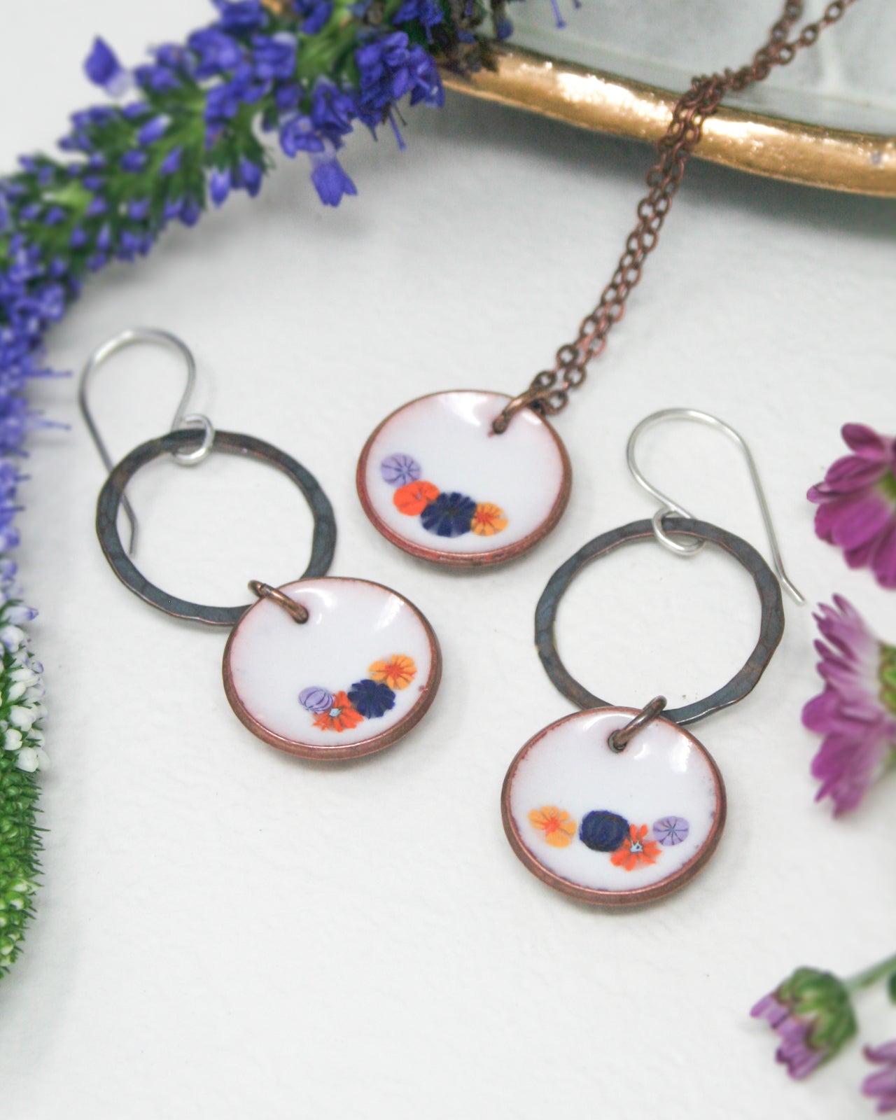 a group of three necklaces sitting on top of a table