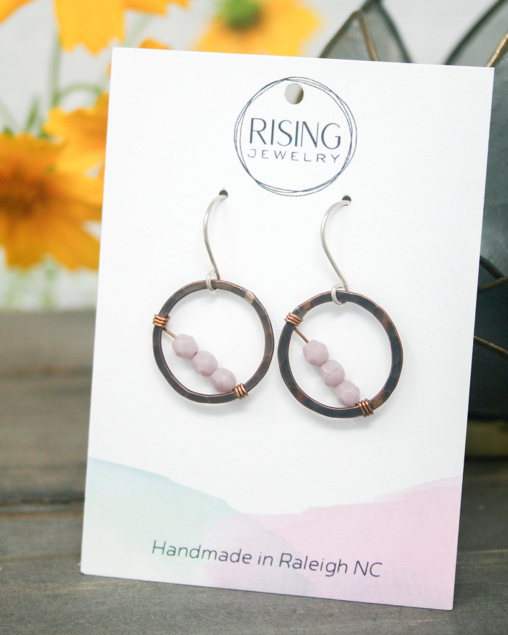 a picture of a pair of earrings on a card