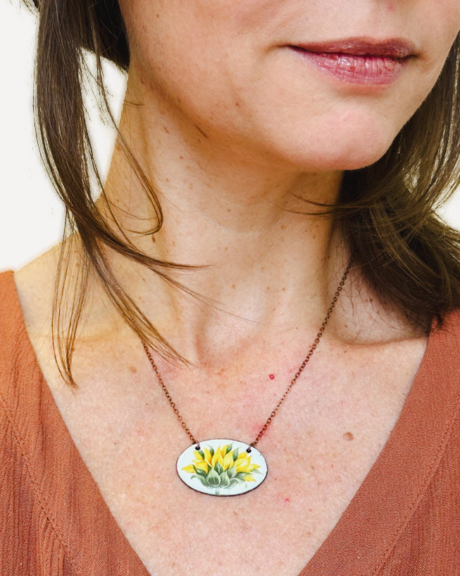 a close up of a person wearing a necklace