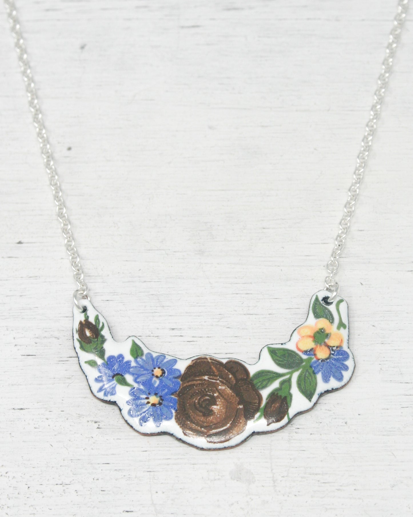 a necklace with a flower design on it