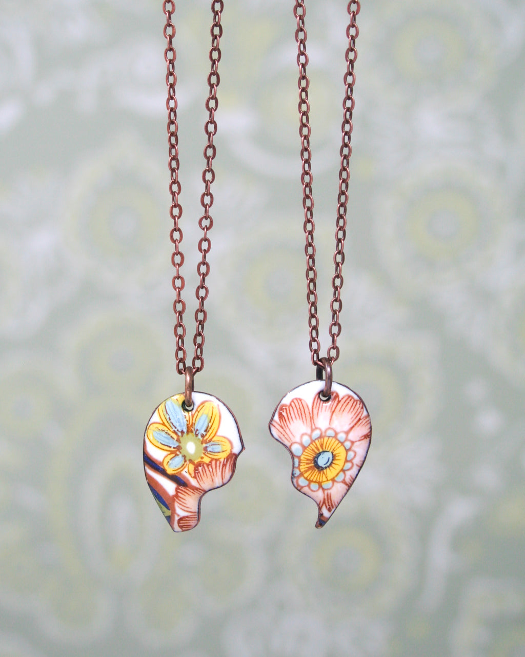 a couple of necklaces that have flowers on them