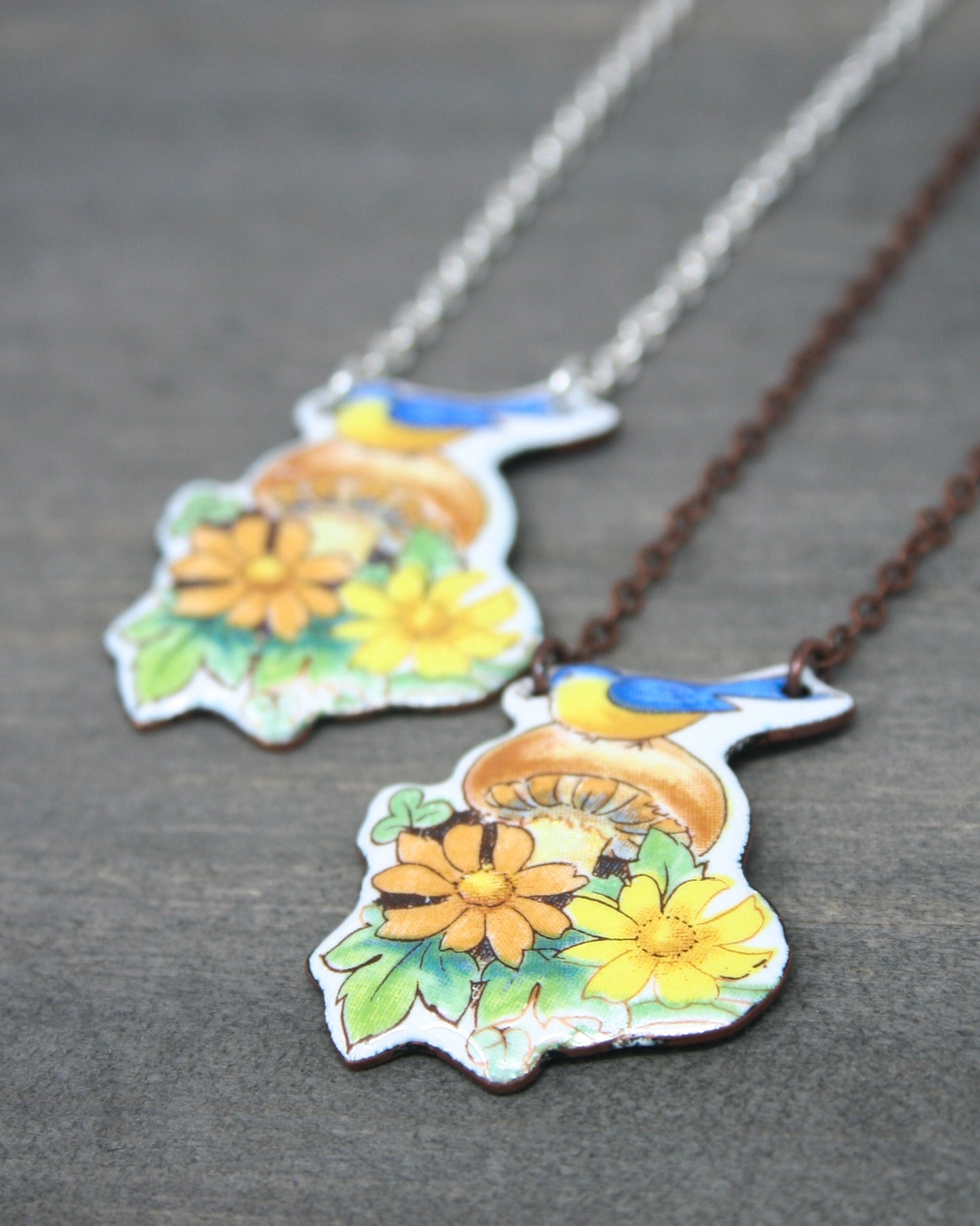 a couple of necklaces sitting on top of a table