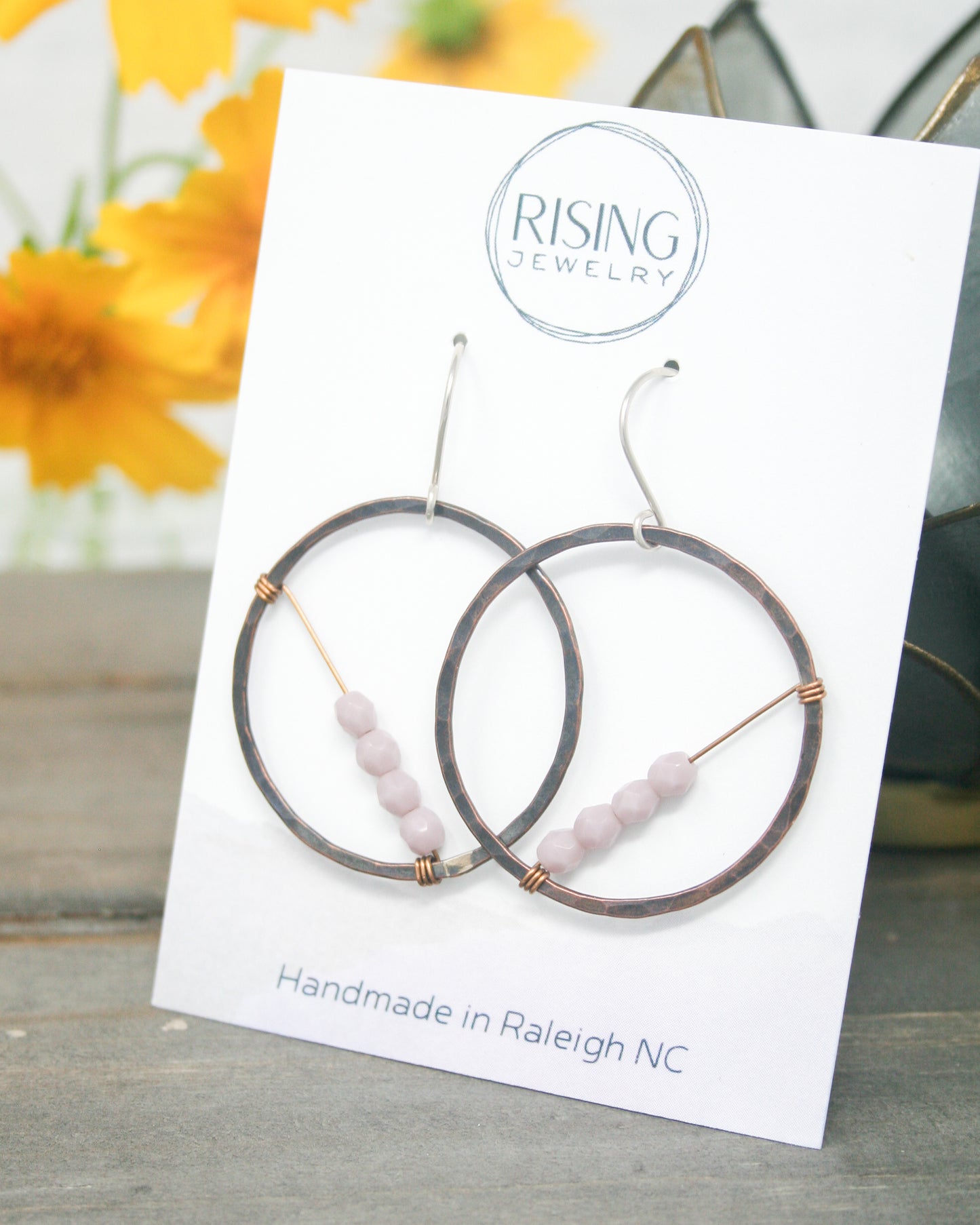 a picture of a pair of earrings on a card