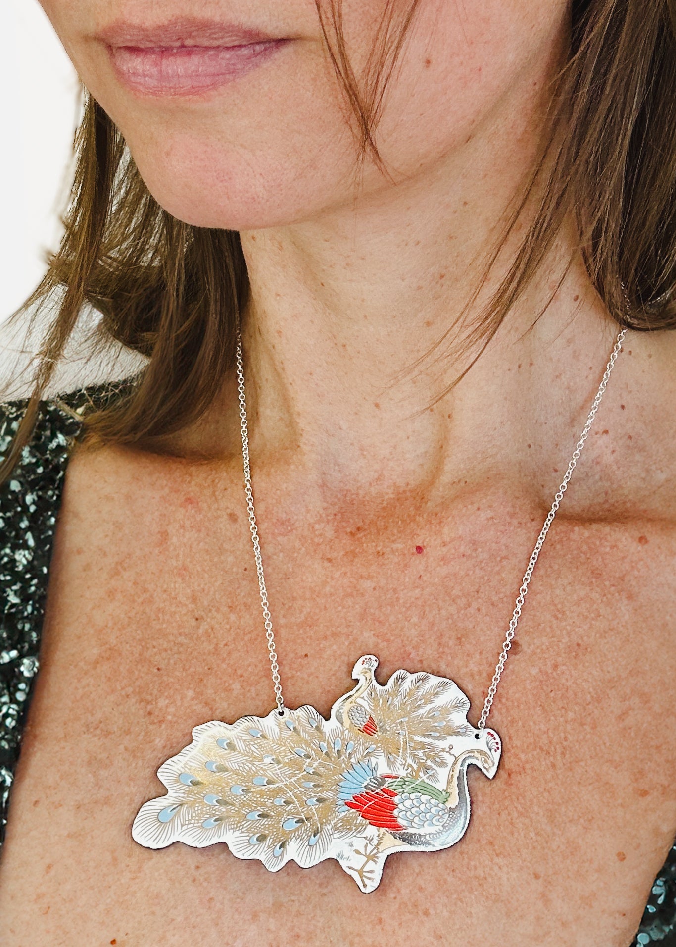 a close up of a woman wearing a necklace