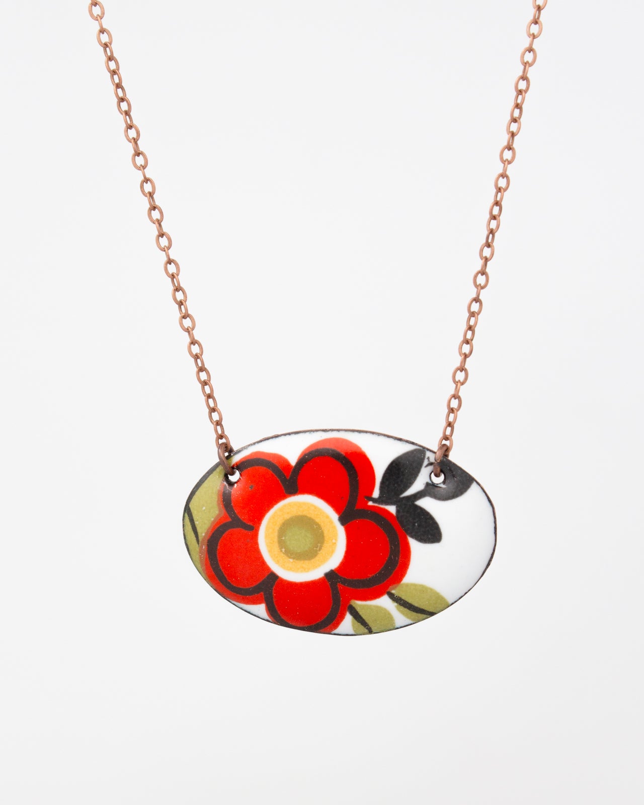 A necklace with a pendant featuring a red flower design.