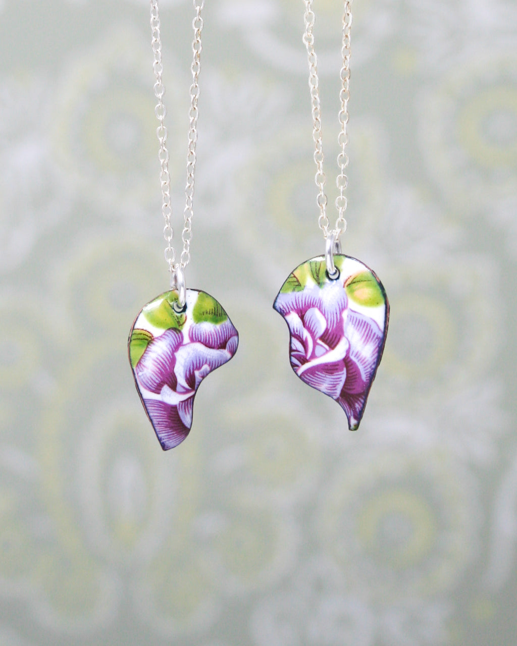 a couple of necklaces that have flowers on them